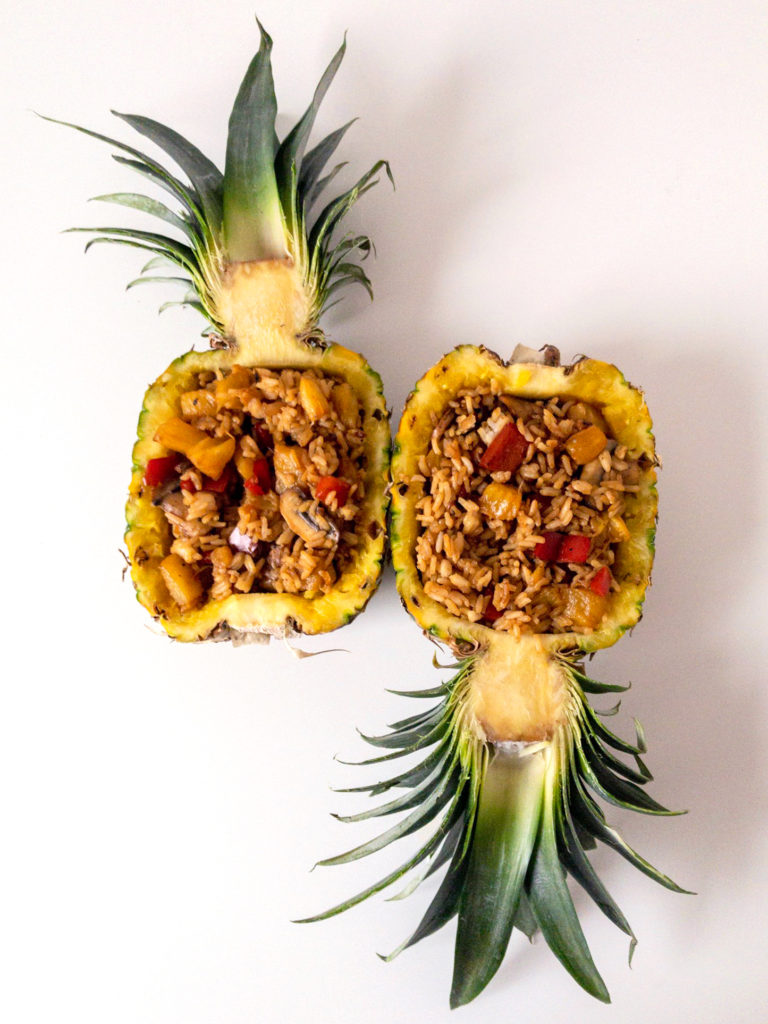 Easy vegan pineapple fried rice in a pineapple bowl.