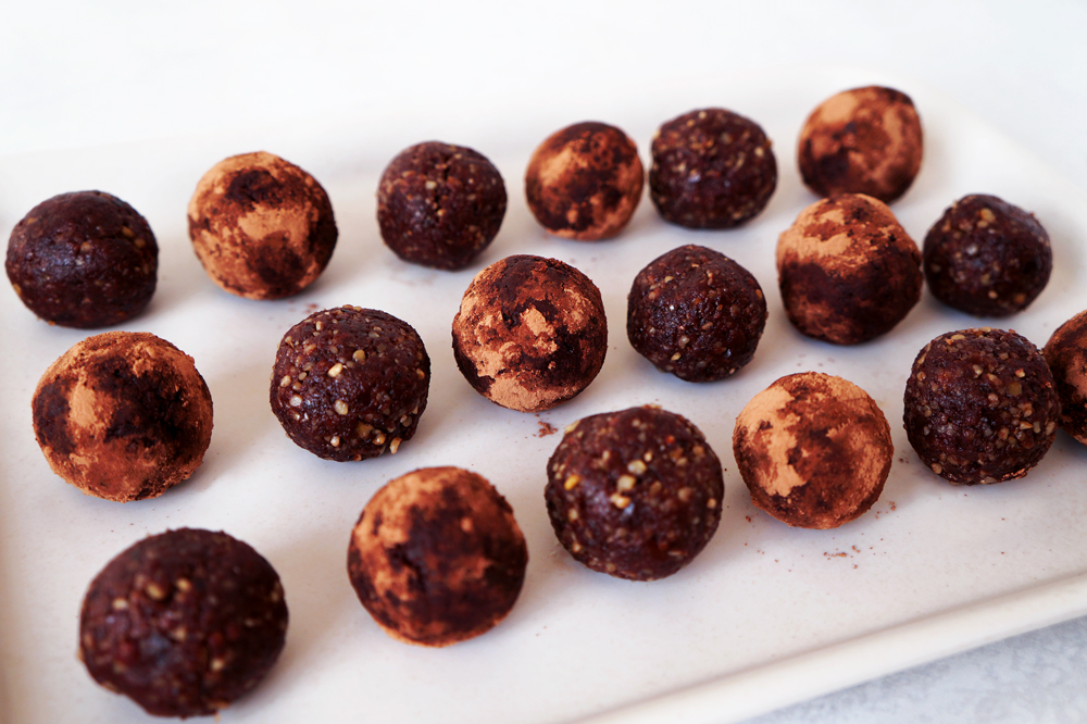 Chocolate walnut bliss balls on a tray