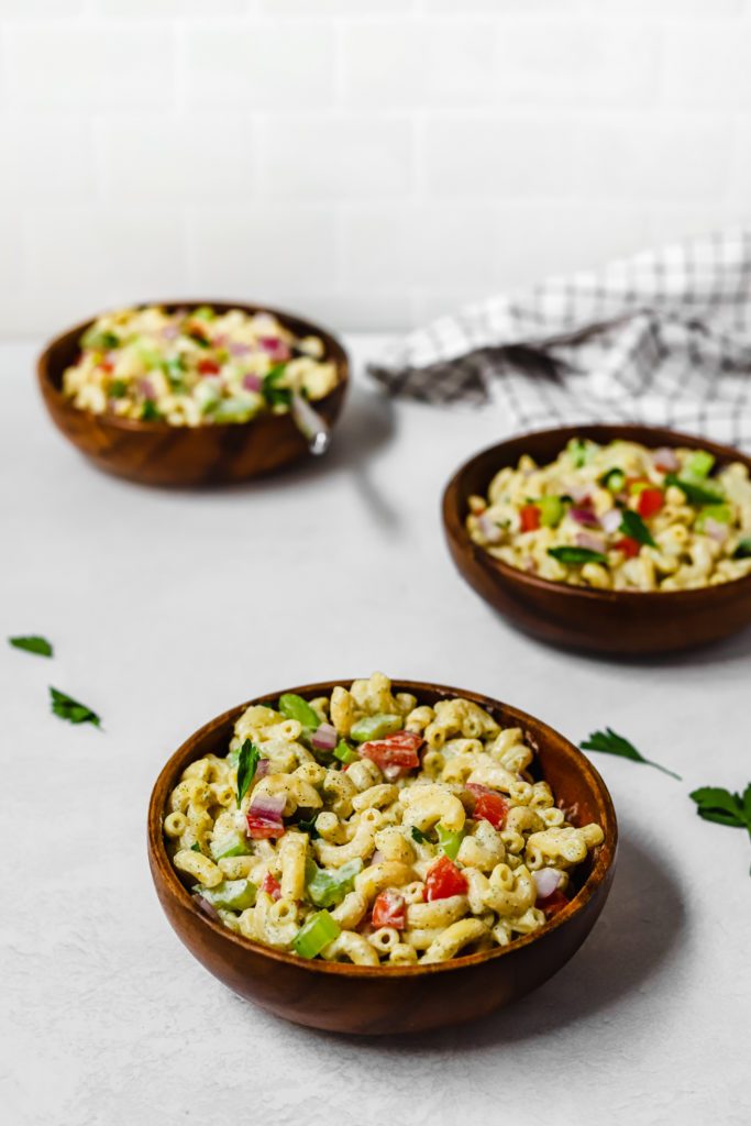 Lightened Up Vegan Macaroni Salad in a small wooden bowl.