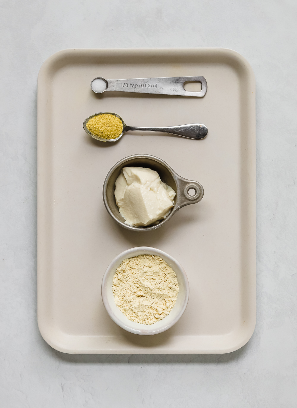 Ingredients to make vegan eggs: chickpea flour, silken tofu, nutritional yeast, and salt. 
